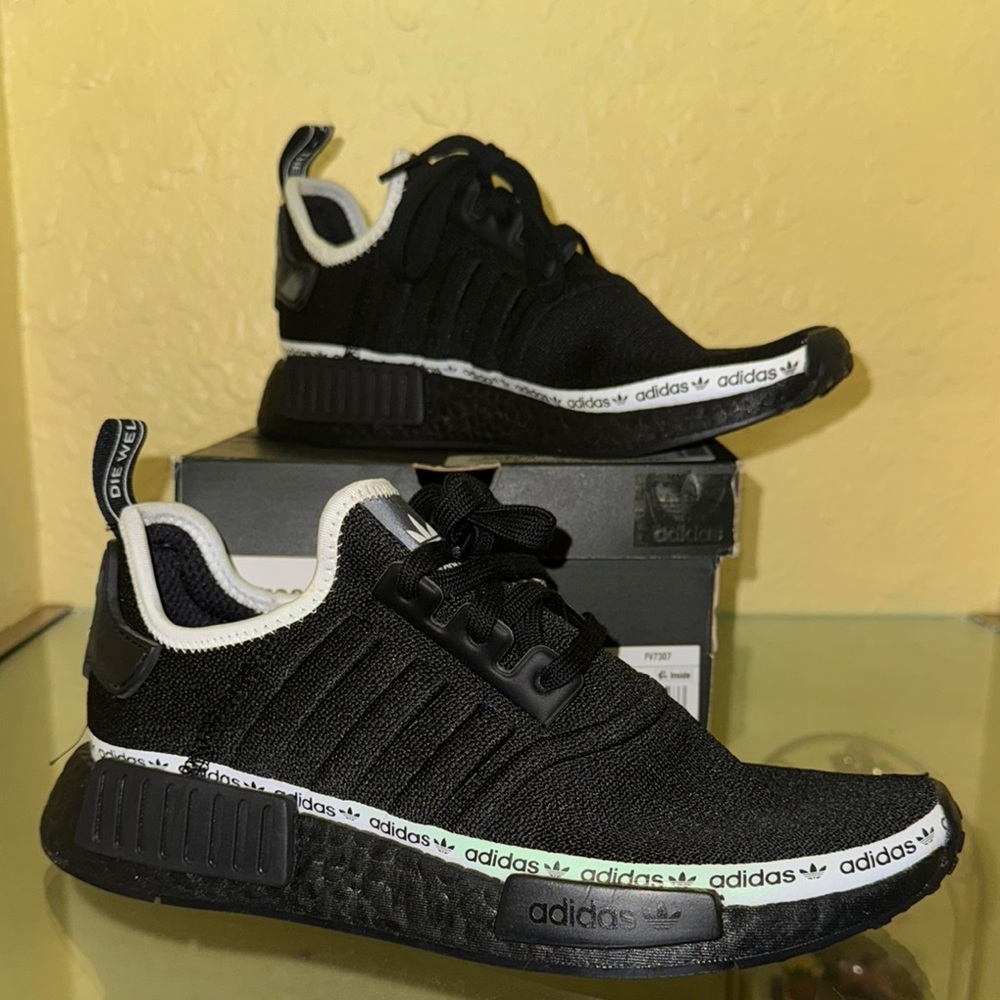 Adidas 2020
Women’s NMD_R1 'Black Tape Logo' size 9